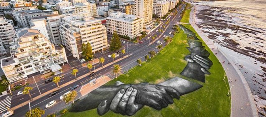 Read more about the article Artist Saype spray paints iconic ‘Beyond Walls’ frescoes in Cape Town